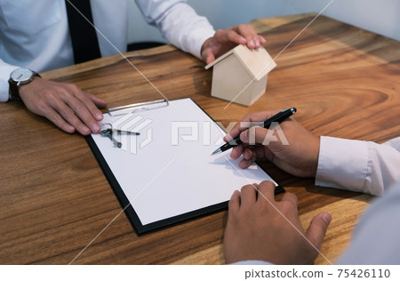 business man signing contract making a deal with real estate agent Concept for consultant. business man signing contract making a deal with real estate agent Concept for consultant. 75426110