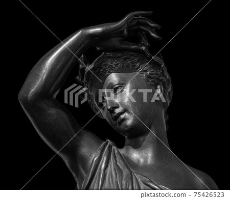 Ancient white marble sculpture head of young woman. Statue of sensual renaissance art era woman antique style. Face isolated on black background Ancient white marble sculpture head of young woman. Statue of sensual renaissance art era woman antique style. Face isolated on black background 75426523
