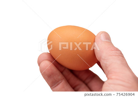 Egg on hand and eggs background for cooking, soft focus 75426904