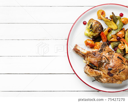 Baked meat with vegetables 75427270