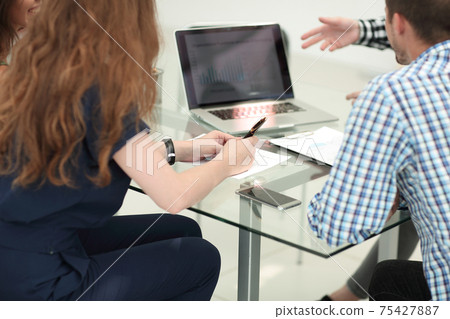 business team discussing financial data in the workplace 75427887