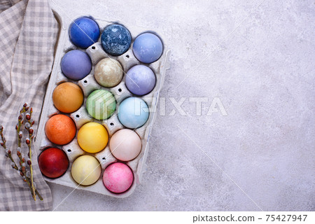 Color Easter eggs painted with organic dye Color Easter eggs painted with organic dye 75427947