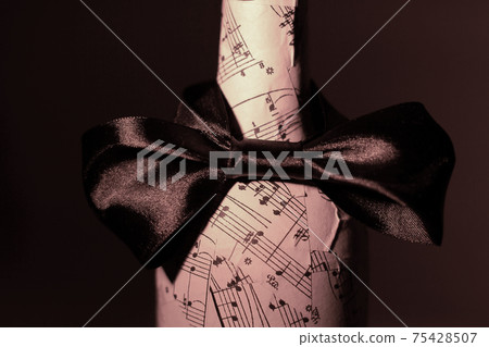 festively decorated bottle of wine.isolated on a dark background festively decorated bottle of wine.isolated on a dark background 75428507