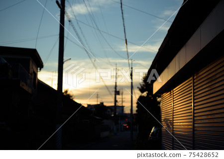 Sunset reflected on the shutter Sunset reflected on the shutter 75428652