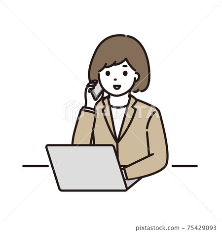 A young woman in a suit making a phone call in front of a computer 75429093