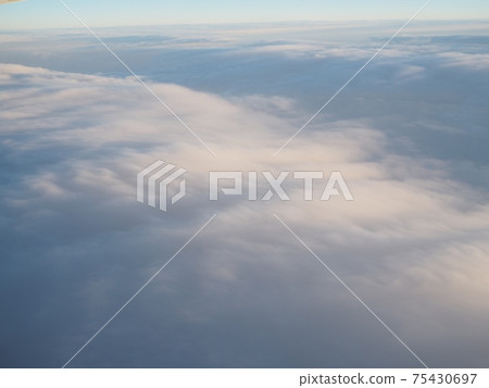 Sea of clouds overlooking from an airplane Evening 75430697