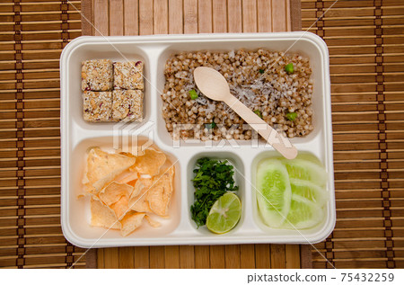 Upvaas Thali or food specially made for fasting, in Maharashtra includes Sabudana khichadi, Rajgira Wadi sweet, papad and Cucumber slices Upvaas Thali or food specially made for fasting, in Maharashtra includes Sabudana khichadi, Rajgira Wadi sweet, papad and Cucumber slices 75432259