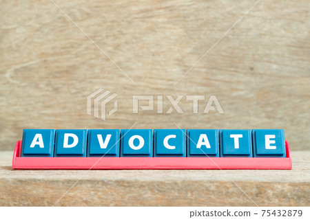 Tile alphabet letter with word advocate in red color rack on wood background Tile alphabet letter with word advocate in red color rack on wood background 75432879