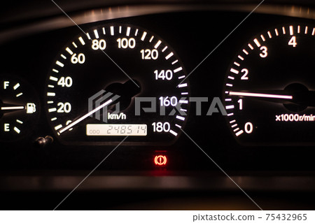 Illuminated car meter at night Illuminated car meter at night 75432965