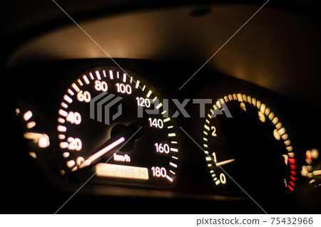 Illuminated car meter at night Illuminated car meter at night 75432966