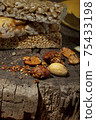 Kozinaki of sesame on the wooden background 75433198
