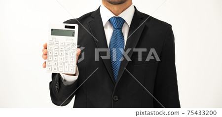 Business image A man with a calculator Business image A man with a calculator 75433200