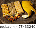 Kozinaki of sesame on the wooden background 75433240