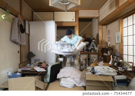 Male worker cleaning the closet 75434477