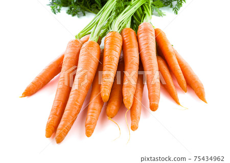 Bunch of fresh carrots with green tops. Isolated on a white. 75434962