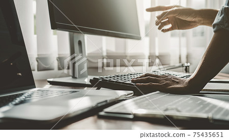 Programmer working in a software development and coding technologies. Website design. Technology concept. Programmer working in a software development and coding technologies. Website design. Technology concept. 75435651