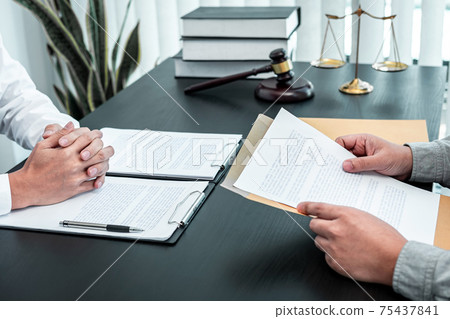Male lawyer discussing negotiation legal case with client meeting with document contract in office, law and justice, attorney, lawsuit concept 75437841