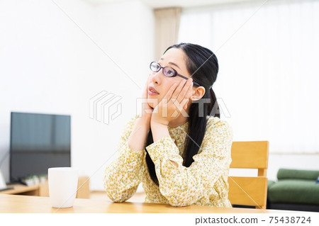 A woman who is worried 75438724