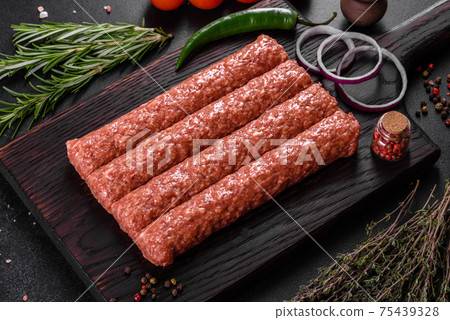 Fresh raw mince for grilled kebab with spices and herbs Fresh raw mince for grilled kebab with spices and herbs 75439328