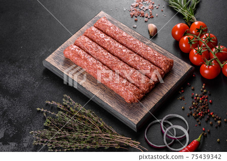Fresh raw mince for grilled kebab with spices and herbs 75439342