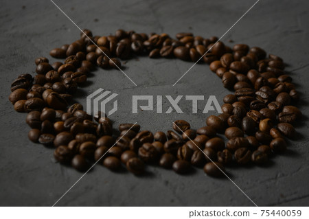 coffee beans on a grey surface 75440059
