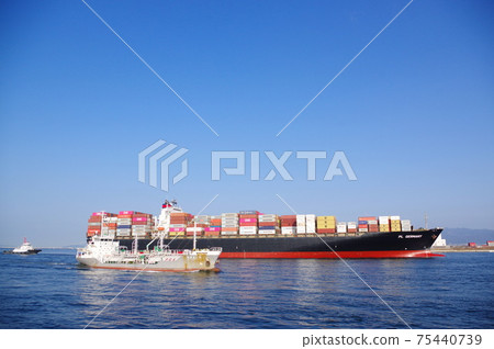 Chemical tankers and large container ships arriving alongside Osaka Port 75440739