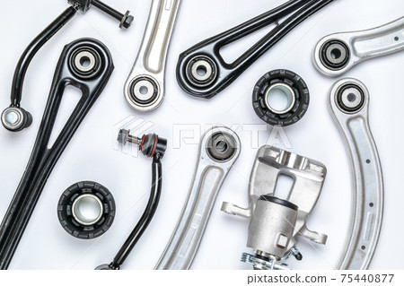 Spark plugs. Auto motor mechanic spare or automotive piece on white background. Set of new metal car part. Flat lay, top view, copy space. 75440877