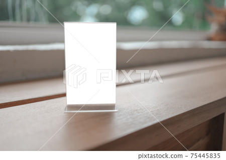 Mock up Menu frame standing on wood table in Bar restaurant cafe. space for text. Mock up Menu frame standing on wood table in Bar restaurant cafe. space for text. 75445835