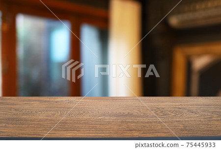 Empty wooden table in front of abstract blurred background of coffee shop . can be used for display or montage your products.Mock up for display of product Empty wooden table in front of abstract blurred background of coffee shop . can be used for display or montage your products.Mock up for display of product 75445933