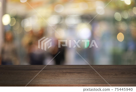 Empty wooden table in front of abstract blurred background of coffee shop . can be used for display or montage your products.Mock up for display of product Empty wooden table in front of abstract blurred background of coffee shop . can be used for display or montage your products.Mock up for display of product 75445940