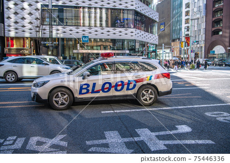Tokyo cityscape of Japan Blood supply vehicle passing through the intersection of Ginza 4-chome 75446336