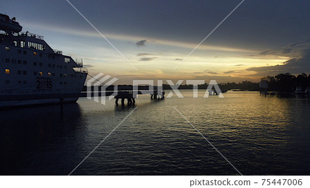 Guatemala, a cruise ship moored in the port of Puerto Quetzal in the evening 75447006