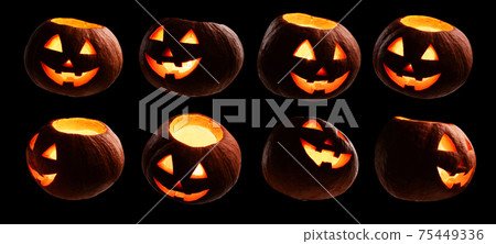 A set of glowing pumpkins. Isolated on a black background A set of glowing pumpkins. Isolated on a black background 75449336