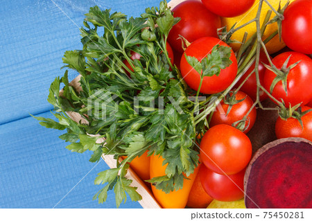 Fruits and vegetables in wooden box. Healthy nutrition, slimming and dieting concept Fruits and vegetables in wooden box. Healthy nutrition, slimming and dieting concept 75450281