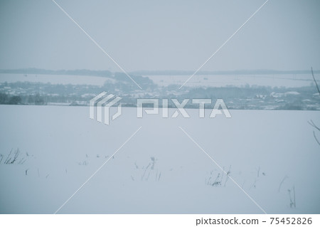 Winter frosty landscape of the river with broken ice 75452826