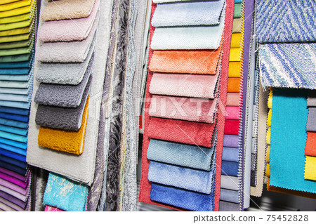 A set of fabric samples for furniture finishing. Multicolored upholstery stripes. 75452828