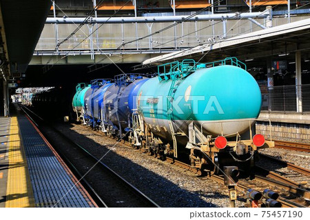 Tank freight train towed by an electric locomotive 75457190
