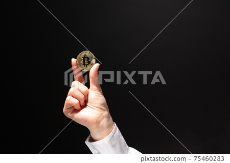 Bitcoin hand woman 75460283