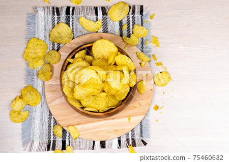 Potato fluted chips close-up. selective focus. fast food Potato fluted chips close-up. selective focus. fast food 75460682
