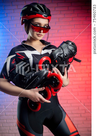cute woman in sportswear and helmet with roller skates 75460783