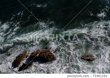 Ocean wave background breaking sea water rocky shore Ocean wave background breaking sea water rocky shore 75461162