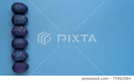 Blue eggs on a blue background Top view 75462064