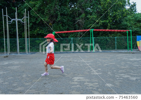 Kids playing outdoors in kindergarten 75463560