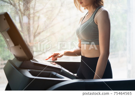 beautiful women exercise training with treadmill in the gym, sport fitness concept 75464565