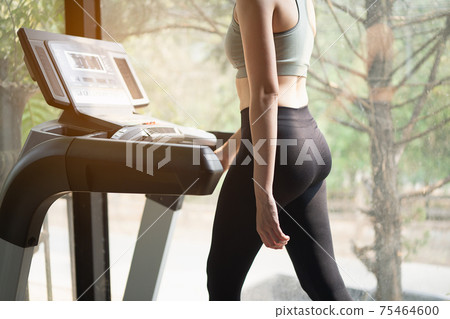 beautiful women exercise training with treadmill in the gym, sport fitness concept beautiful women exercise training with treadmill in the gym, sport fitness concept 75464600