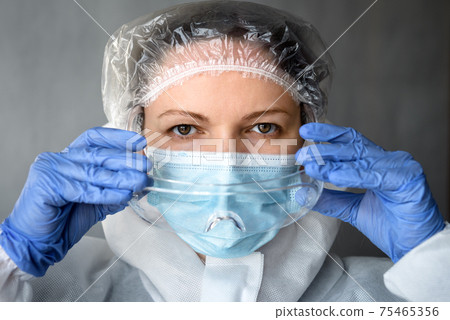 Portrait of doctor in medical PPE suit Portrait of doctor in medical PPE suit 75465356