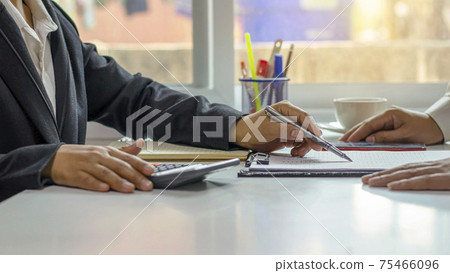 Business people working together on desks in office conference room teamwork concept, soft focus. 75466096