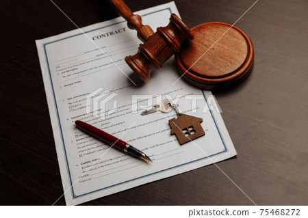 House keys and money on a signed contract of house sale. Focus on keys. House keys and money on a signed contract of house sale. Focus on keys. 75468272