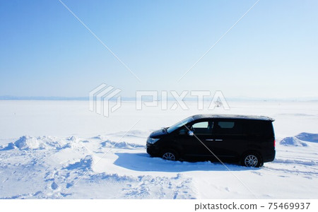 Car running in the snow field 75469937