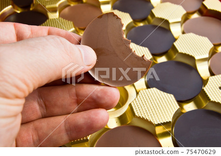 Tasty round chocolates with milk and bitter, in stylish decorative box 75470629